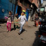 kids walking down the street in dharavi